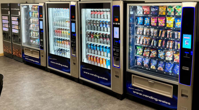 Several vending machines lined up, offering snacks and drinks.